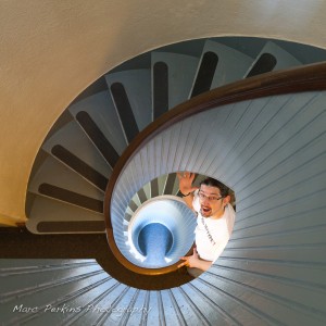 I'm standing on the second level of the stairway to the top of the Old Point Loma Lighthouse in Cabrillo National Monument, waving up at the camera. Greg (of Alpenglow Images Photography) is nicely pressing the trigger of my tripod-mounted camera.