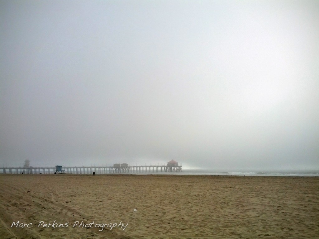 Fog arrives at the Huntington Beach Pier.