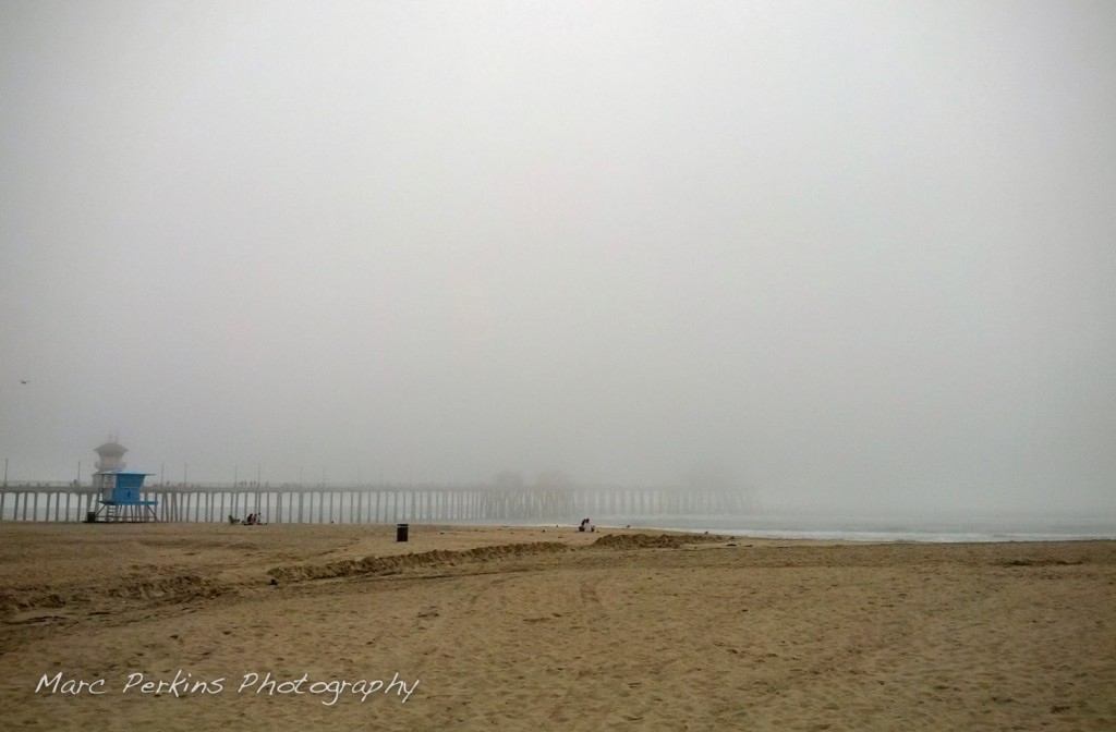 Fog shrouds the Huntington Beach Pier.