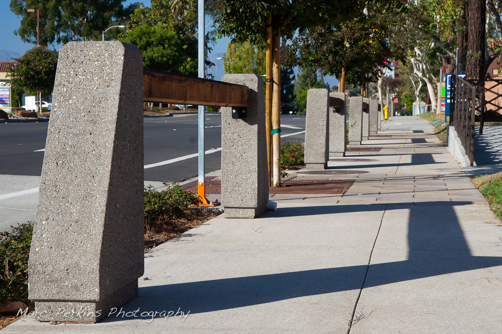 Parkway features of the northeastern portion of the Grand and Diamond Bar intersection - large wooden beams, trees with iron grates, and colored concrete. This was part of the 2015 rebuild of the Grand Avenue and Diamond Bar Boulevard intersection for Diamond Bar's 2015 "Grand Avenue Beautification" project, landscape architecture for the project was by David Volz Design.