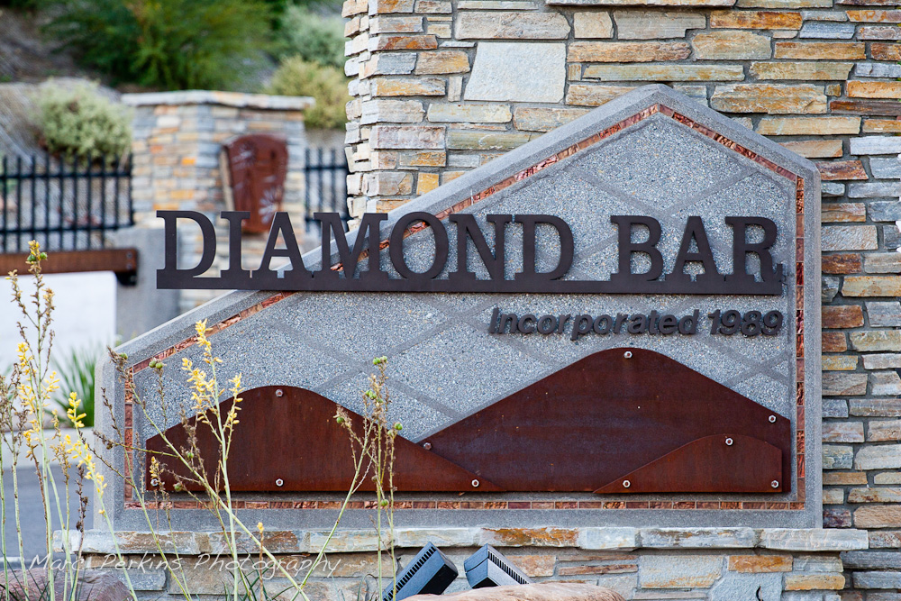 The entrance sign to Diamond Bar on the eastern edge of the city. This image, taken in the shade, highlights the coppery accents of the sign. This was part of the 2015 rebuild of the Grand Avenue and Longview Drive intersection for Diamond Bar's 2015 "Grand Avenue Beautification" project, landscape architecture for the project was by David Volz Design.
