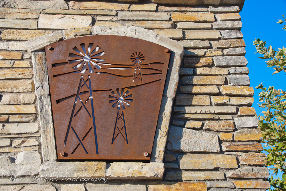 Metallic cutouts with a windmill pattern are frequent in the Grand Ave. corridor; this one is on the large entrance sign on the eastern edge of the city. This was part of the 2015 rebuild of the Grand Avenue and Longview Drive intersection for Diamond Bar's 2015 "Grand Avenue Beautification" project, landscape architecture for the project was by David Volz Design.