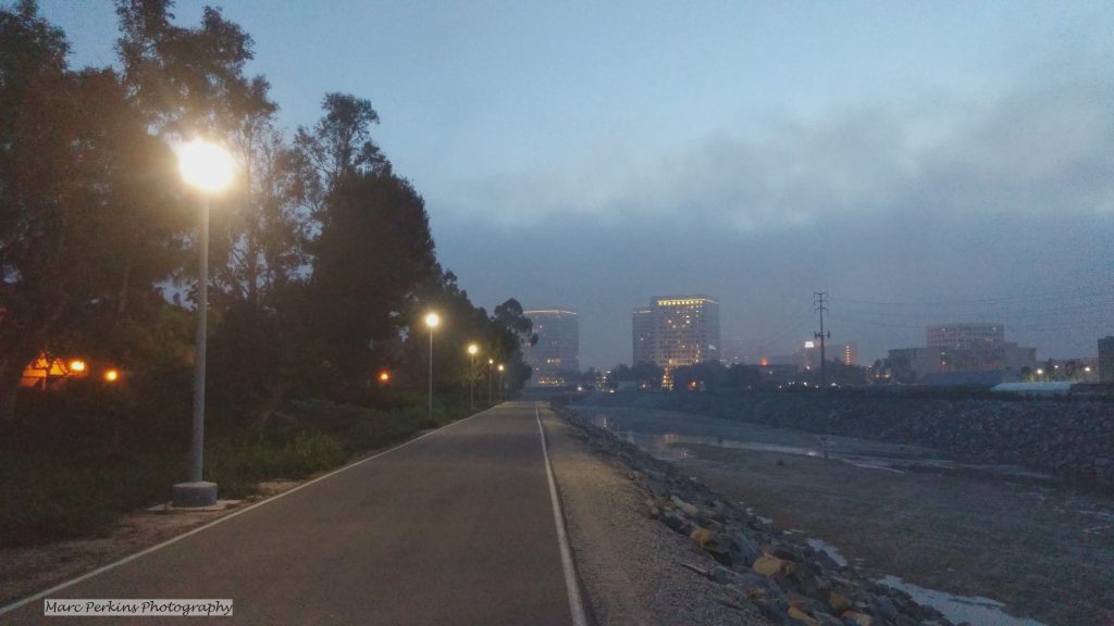 lights illuminate the fog-shrouded bike trail.