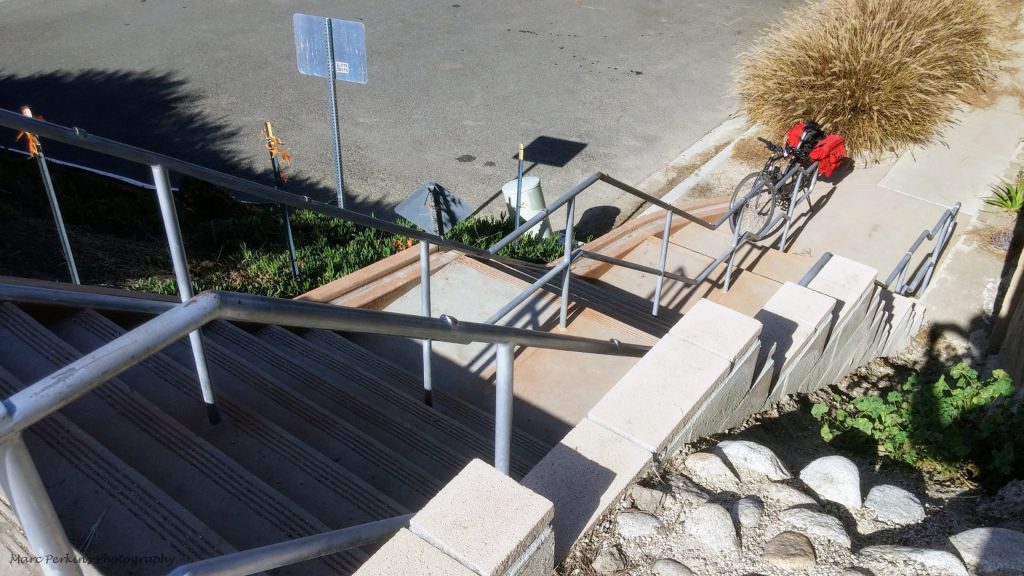 Bike at the bottom of stairs.